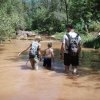 wading through a muddy Christopher creek