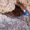 Checking out a cave on the Bulls Eye trail loop
