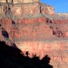 Hiker shadowed against the redwall