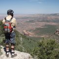 Mountain biker enjoying the views from the Rainbow Rim trail