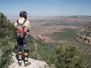 Mountain biker enjoying the views from the Rainbow Rim trail